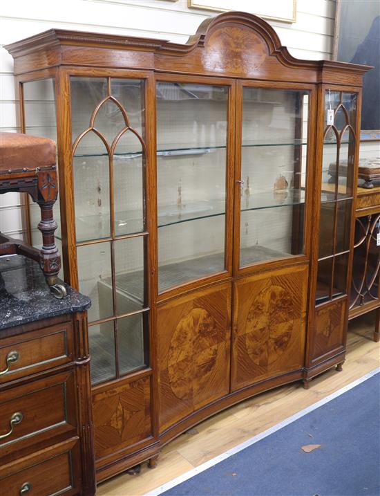An Edwardian satinwood concave-fronted display cabinet W.166cm